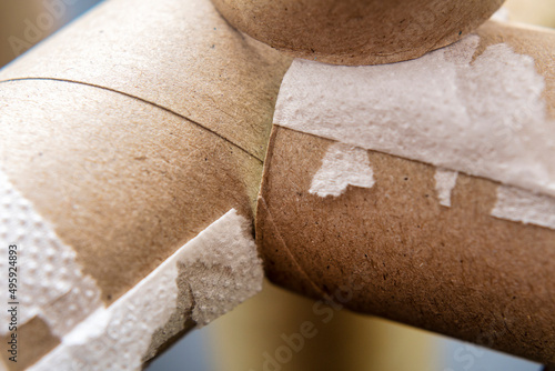 Close-up of empty toilet paper rolls against a dark background. Background on the theme of ecology and recycling of materials.