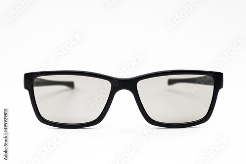 Classic black-framed glasses on a white background. Tinted eyeglasses. Not an isolate.