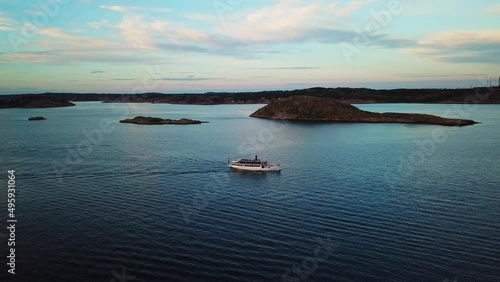 Wallpaper Mural Drone tracking a small ferry sideways during sunset. Torontodigital.ca