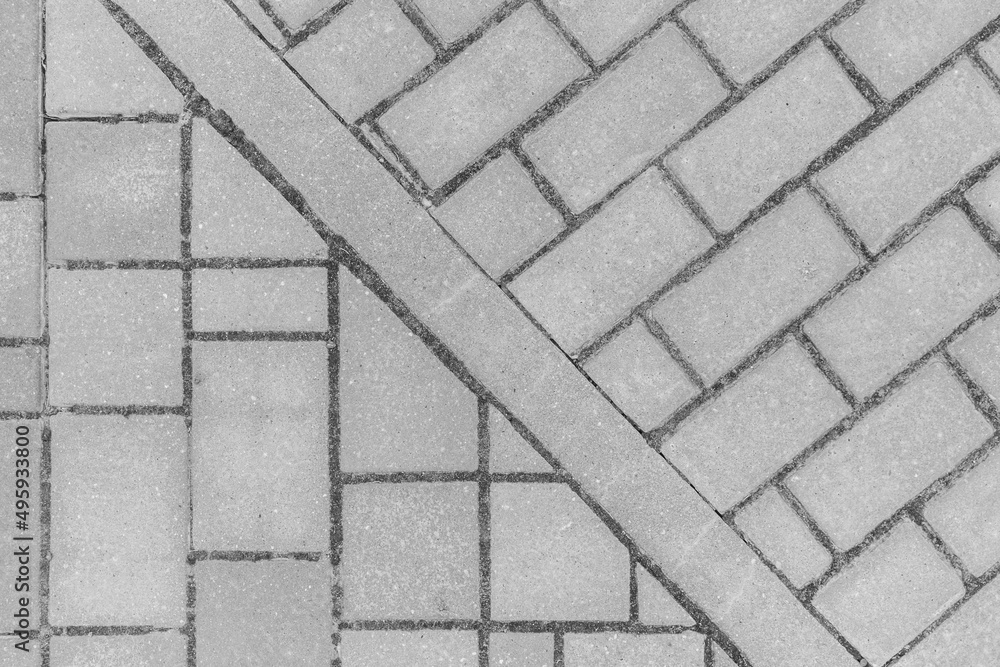 Obraz premium Gray sidewalk tile street stone city road abstract urban pattern design texture paving background