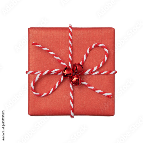 Christmas present box wrapped in red paper with baker’s twine bow isolated on white background