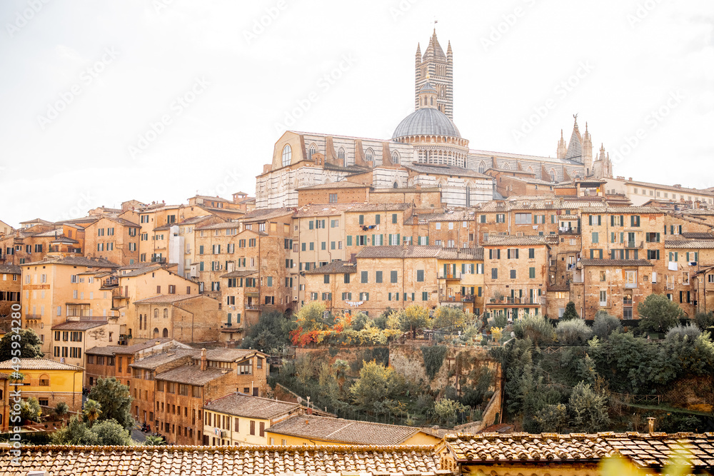 Cityscape of Siena town with Duomo cathedral in Tuscany region of Italy. Concept of visiting italian landmarks