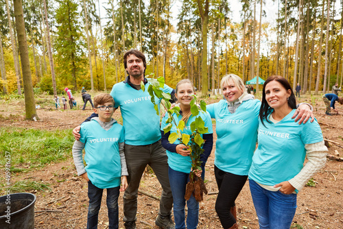Happy family with children as environmentalists team