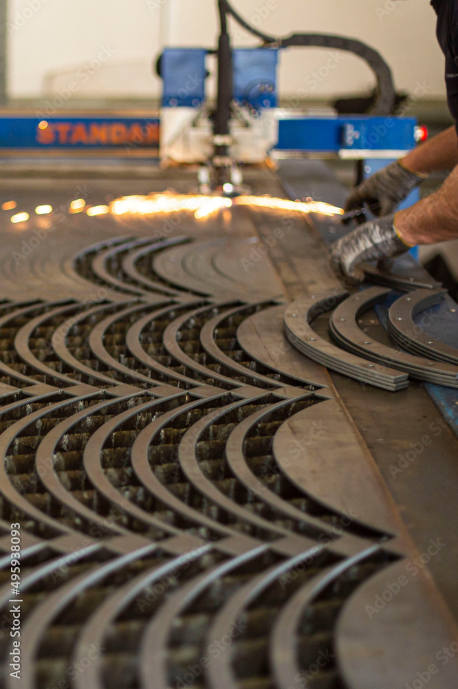 cnc metal turning milling machine during the process of making blanks, the front and background are blurred with a bokeh effect cnc metal turning milling machine during the process of making blanks, the front and background are blurred with a bokeh effect