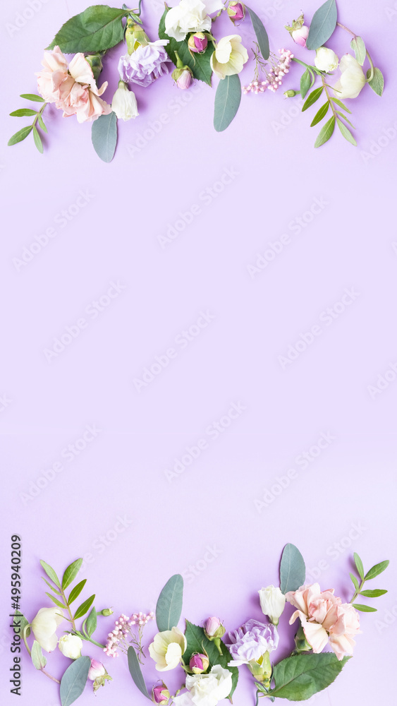 Floral frame with pink roses, white flowers, branches, leaves and petals on purple background. Flat lay, top view Floral frame with pink roses, white flowers, branches, leaves and petals on purple background. Flat lay, top view