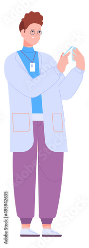 Man in lab coat dropping liquid in test glass tube