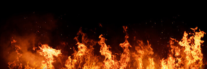 Burning red hot sparks rise from large fire in the night. Fire flames sparks background. Abstract dark glitter fire particles lights.