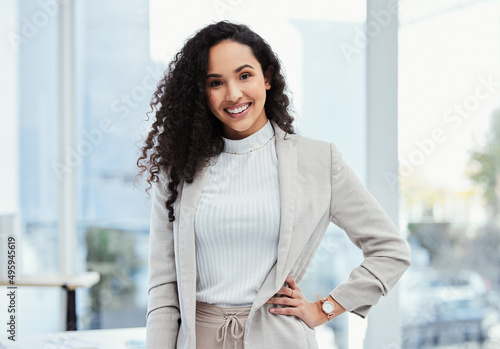 Free Download This is what professional excellence looks like. Shot of a young businesswoman in her office. - GFXLoad