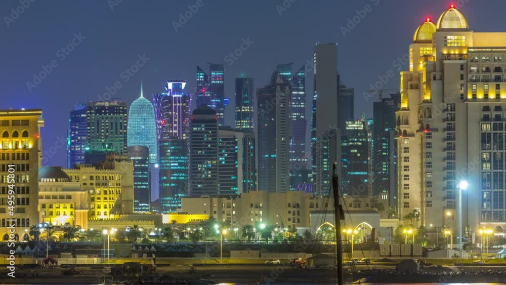 View from Katara Beach day to night timelapse in Doha, Qatar, towards the West Bay and city center View from Katara Beach day to night timelapse in Doha, Qatar, towards the West Bay and city center