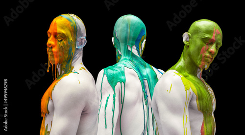 Colorful collage. Male body and face covered with multicolored paints isolated over black background. Muscular build