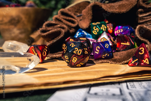 close-up of RPG dice spilling out of a dice bag