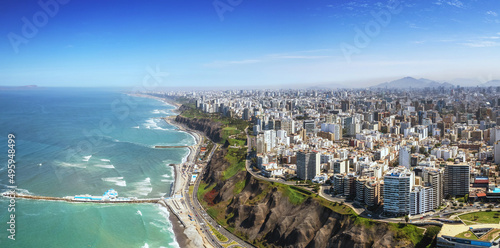 Aerial panorama of Lima, Peru along the coast also known as Circuito de Playas de la Costa Verde at a golden hour sunset photo