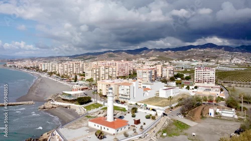 Torrox Costa view from above. Drone footage of this costal city situated in Malaga province, Costa del Sol - Spain. Touristic travel destination. Drone rotating and panning right photo