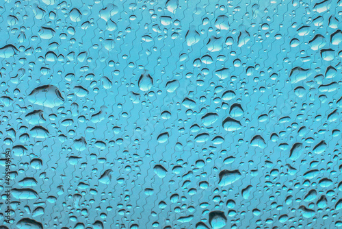 Raindrops on the windshield of the car early . morning close-up