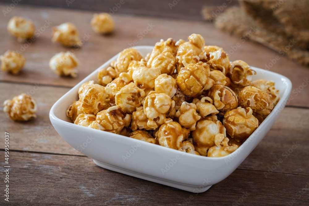 Popcorn with caramel in white bowl Popcorn with caramel in white bowl