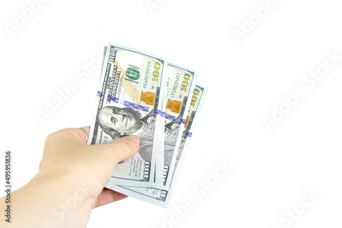 A lot of American currency in a female hand. Cropped Hand Of Woman Hold Paper Currencies On White Background