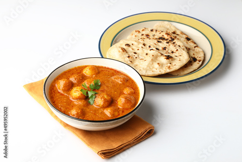 Dum aloo or potato curry with butter nan, tandoori roti photo