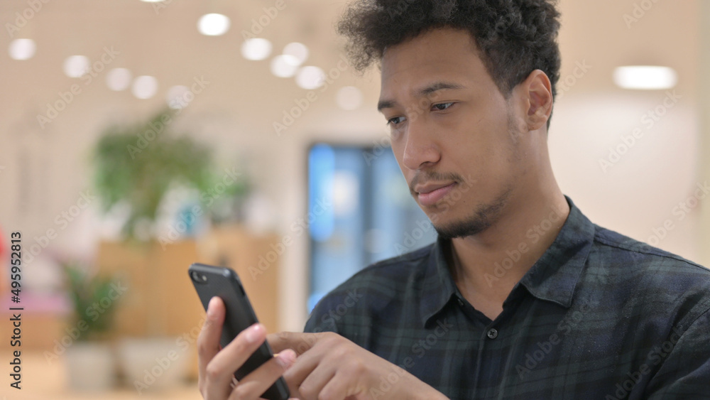 African American Man using Smartphone African American Man using Smartphone