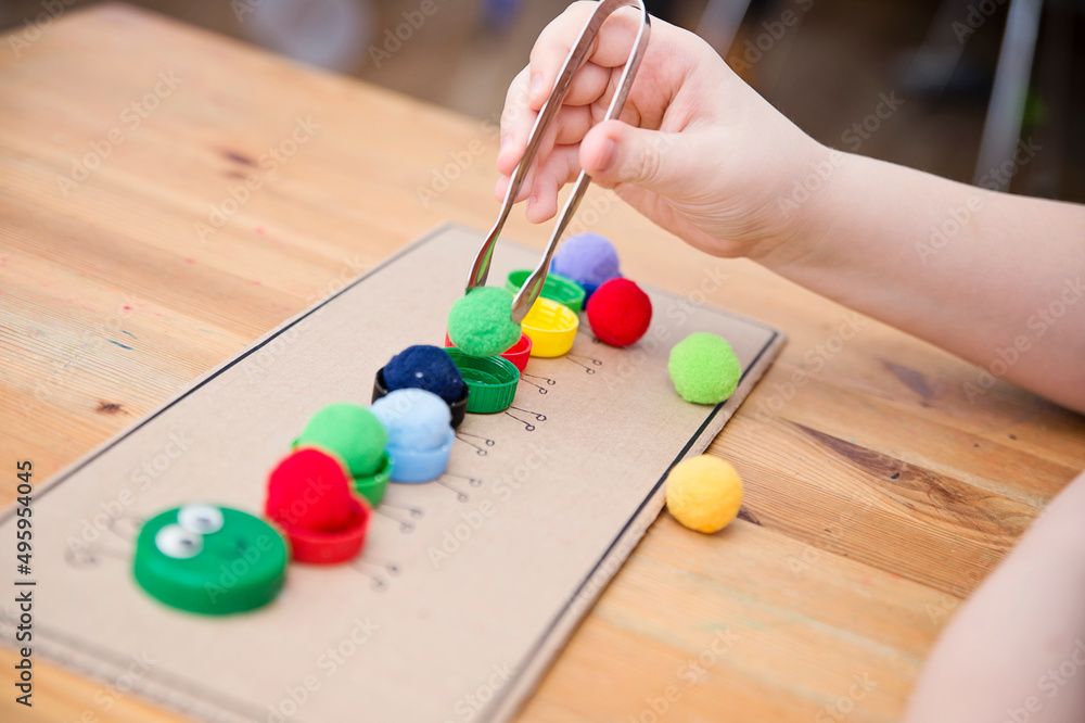 Plastic bottle caps worm. Put correct color pom poms in centipede ...
