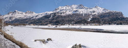 river Inn flowing among snowy plains, Sils, Switzerland photo