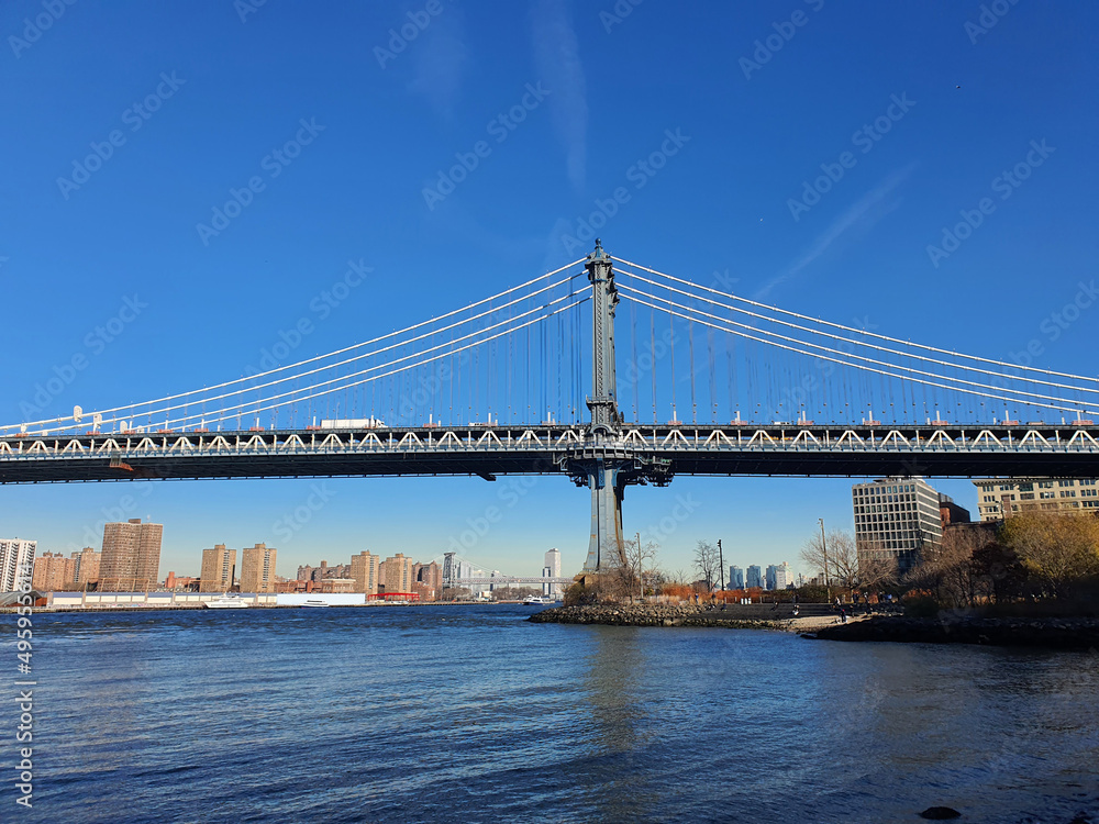 The Manhattan Bridge is a suspension bridge across the East River in New York City. The bridge was designed by Leon Moyzff. It is now a major tourist destination in New York, USA. The Manhattan Bridge is a suspension bridge across the East River in New York City. The bridge was designed by Leon Moyzff. It is now a major tourist destination in New York, USA.
