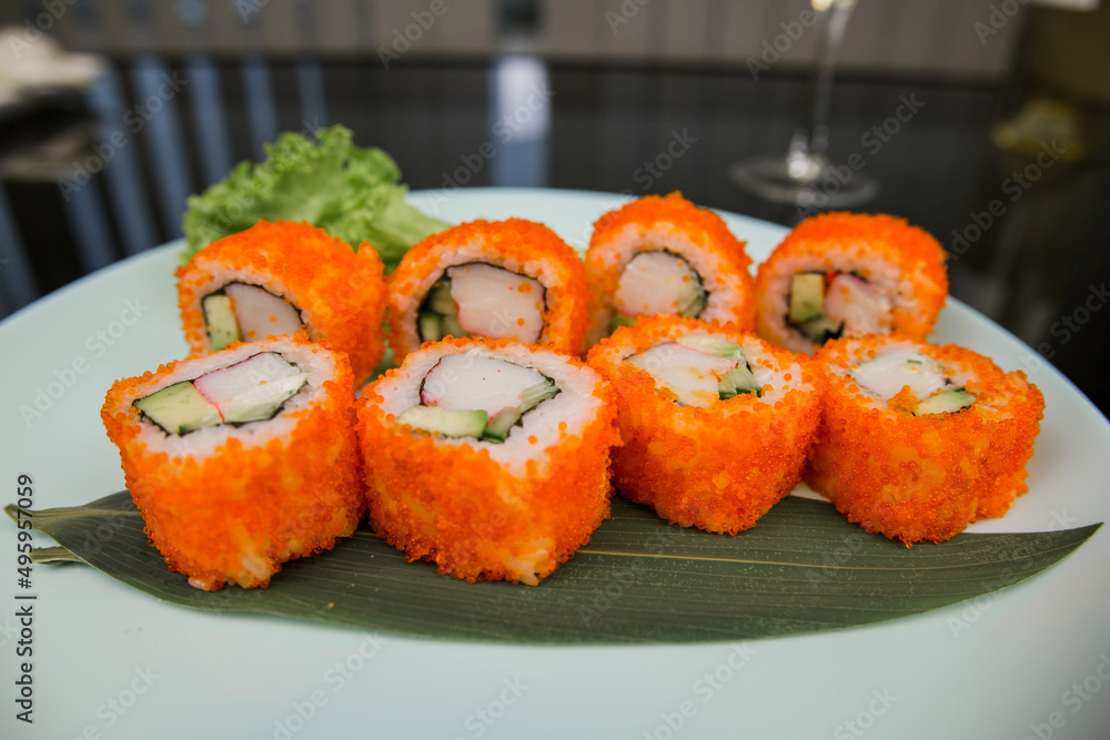 Japanese roll with tuna and white rice in tobiko caviar Japanese roll with tuna and white rice in tobiko caviar