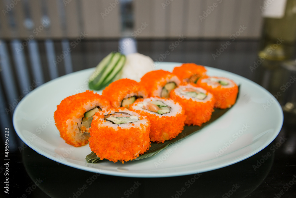 Japanese roll with tuna and white rice in tobiko caviar