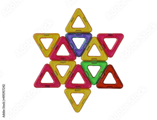 Star-shaped, lined with multicolored parts of a magnetic constructor, isolated on a white background. photo