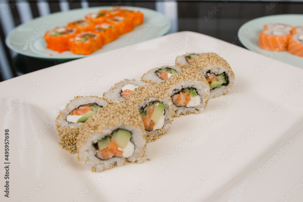 Philadelphia roll with salmon in sesame and white rice