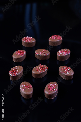 Chocolates in a black background.