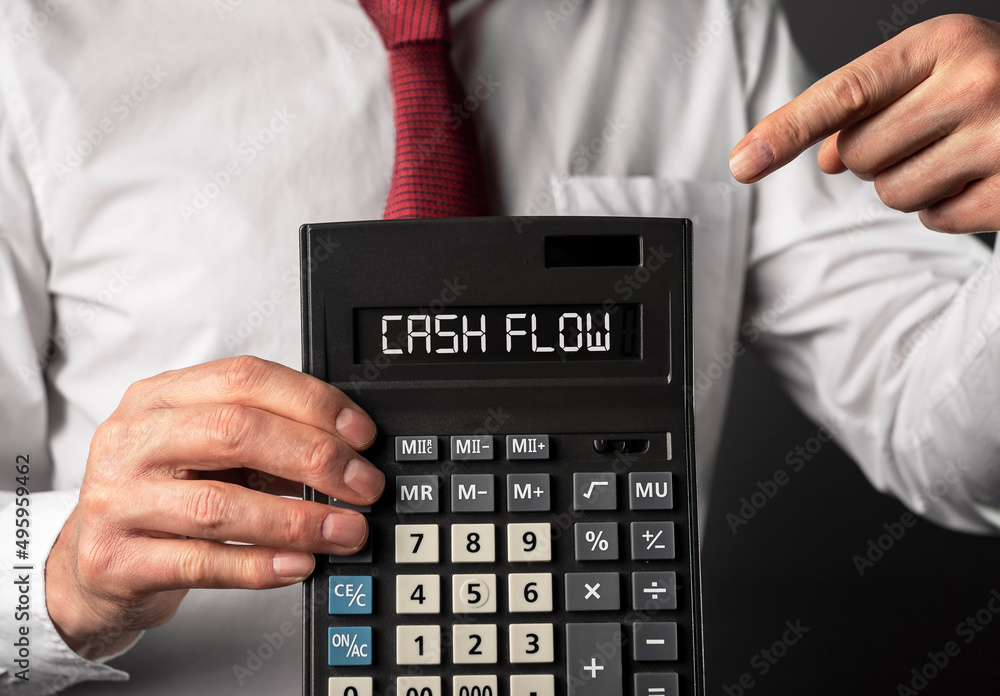 Cash flow word on calculator for business finance. High quality photo Cash flow word on calculator for business finance. High quality photo