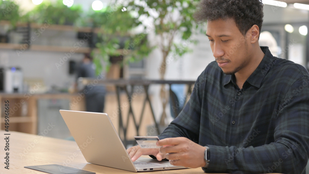 African American Man Shopping Online on Laptop African American Man Shopping Online on Laptop