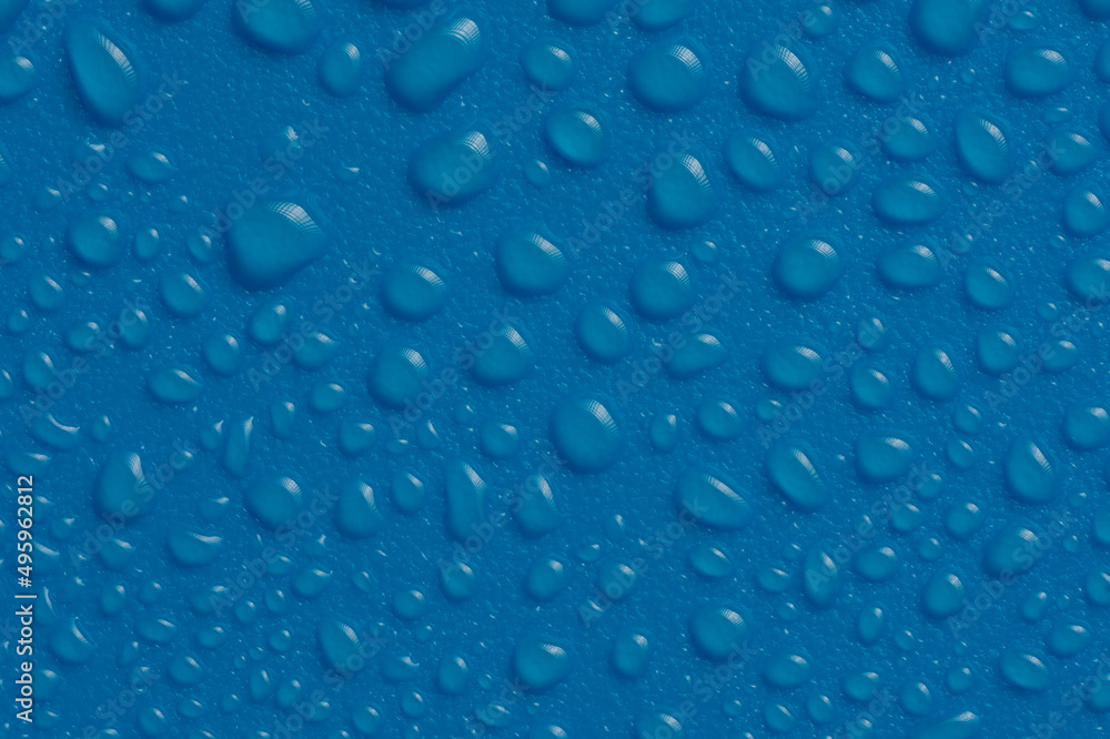 Water Drops On the blue Background. Abstract orange wet texture with bubbles on plastic PVC surface or grunge.