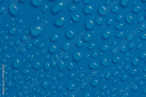 Water Drops On the blue Background. Abstract orange wet texture with bubbles on plastic PVC surface or grunge.
