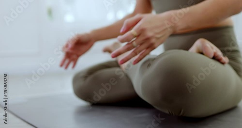 Close-up of hands doing lotus pose or Padmasana of yoga Meditation exercises for good health. Health care Workout at apartment. Muscle therapy with yoga. Activities relax body and mind during holidays photo