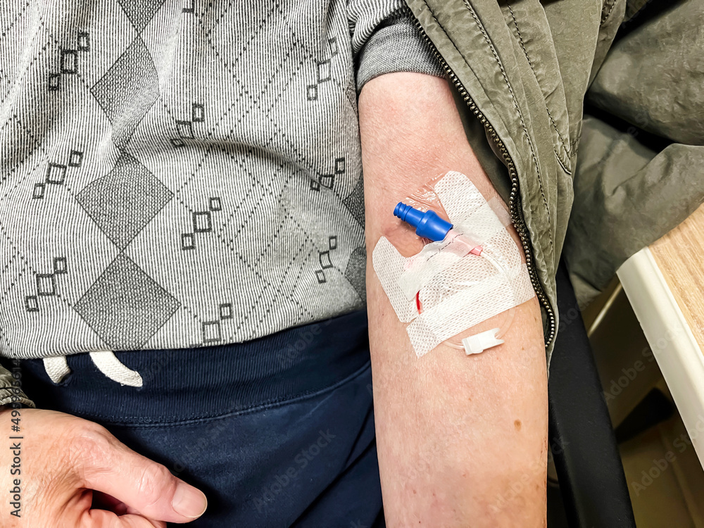 Close up of senior male patient doing blood testing work with