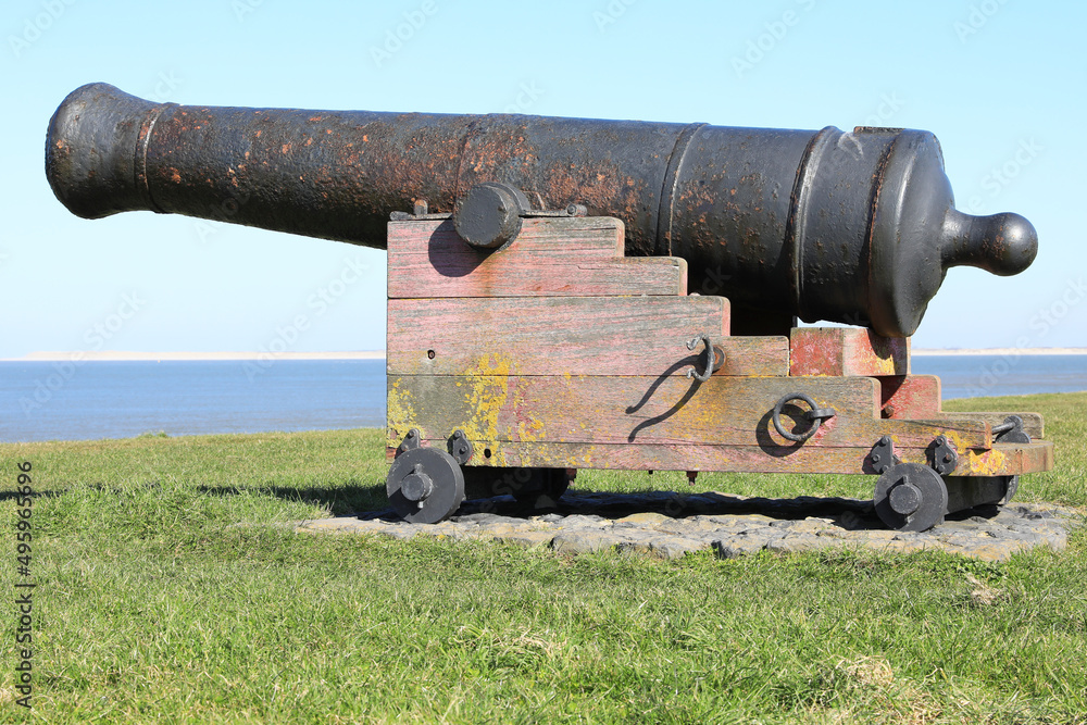 Historic cannon on a dike in North Holland, Netherlands