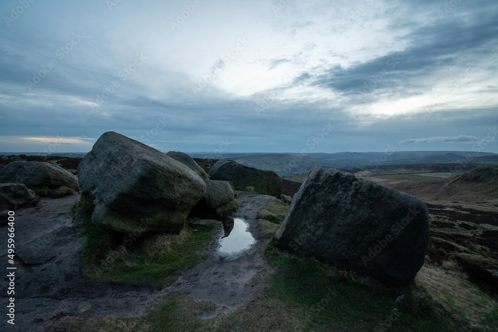 Fototapeta premium Rocks and hilly scenery of Higger Tor. Natural rock formation in the Peak District, close to Sheffield, UK