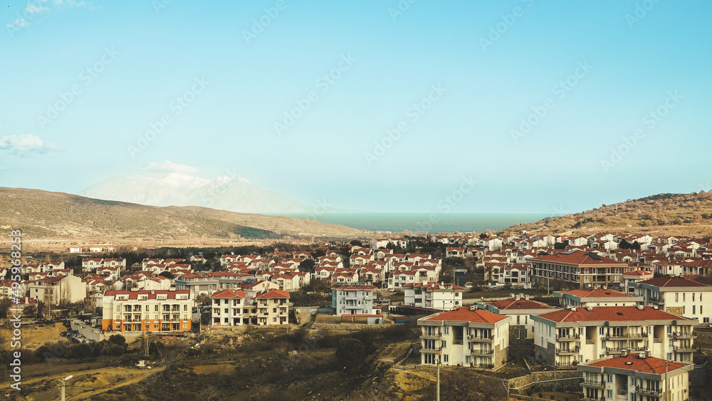 Gökçeada-Imbros Island Turkey city center view with buildings. View of Samothrace, the greek island across from the center of Gökçeada