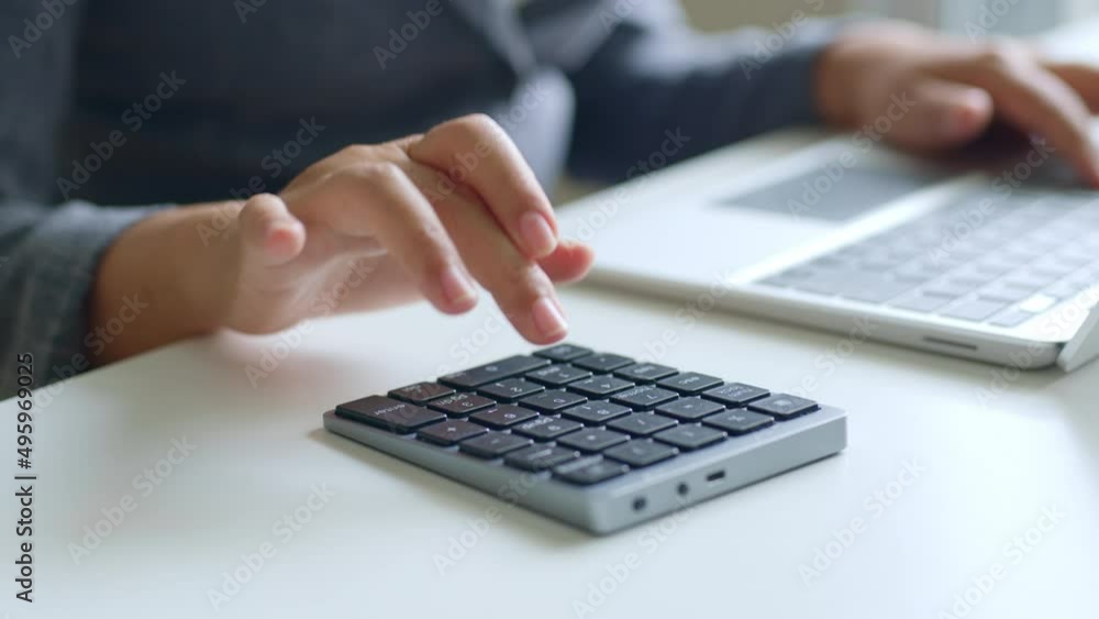 Close up of accountant typing / calculating for investment, budget, income and profit. Finance and accounting concept Close up of accountant typing / calculating for investment, budget, income and profit. Finance and accounting concept