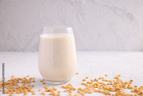 Soy milk in glass and soy bean isolated in white background