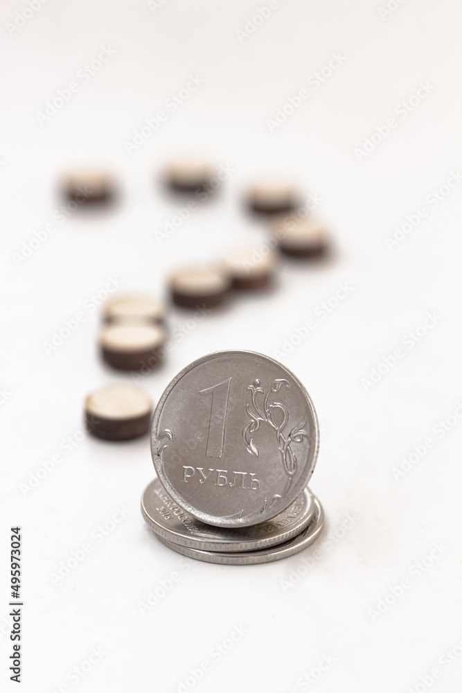 Сoin one Russian ruble and a question mark on white background Сoin one Russian ruble and a question mark on white background