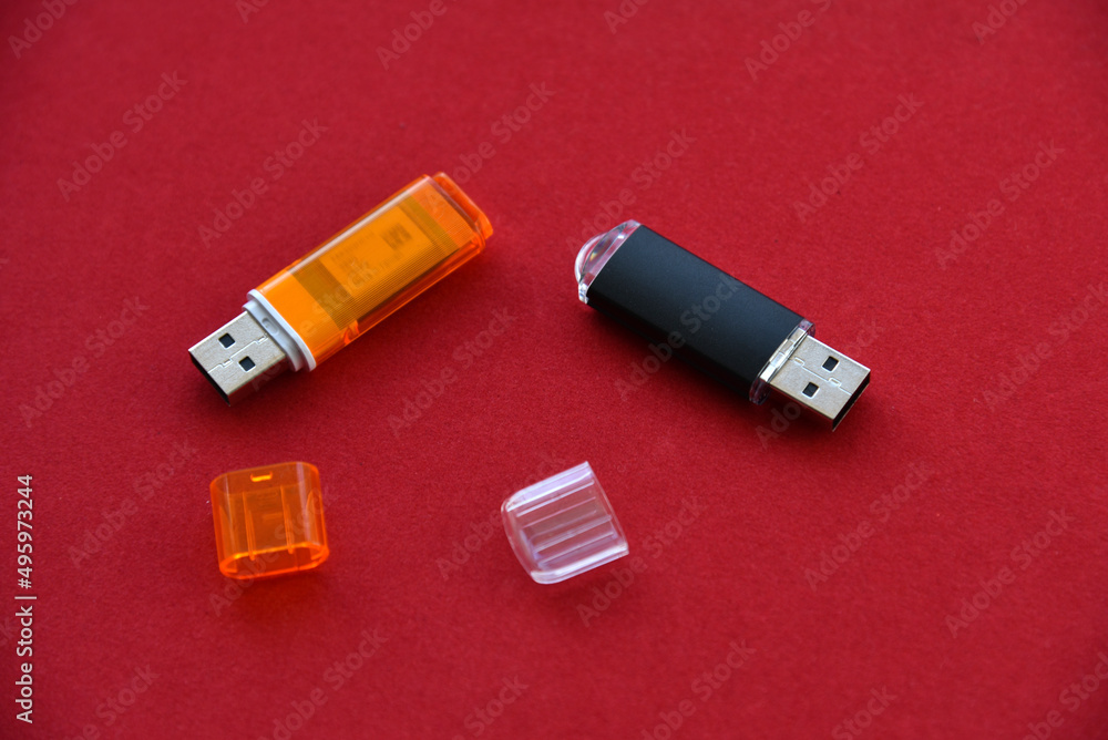 Various USB flash drives on a red background Various USB flash drives on a red background