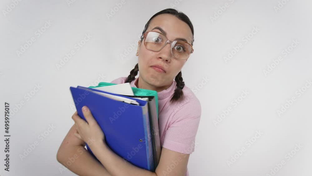 Clumsy woman in glasses with folders Clumsy woman in glasses with folders