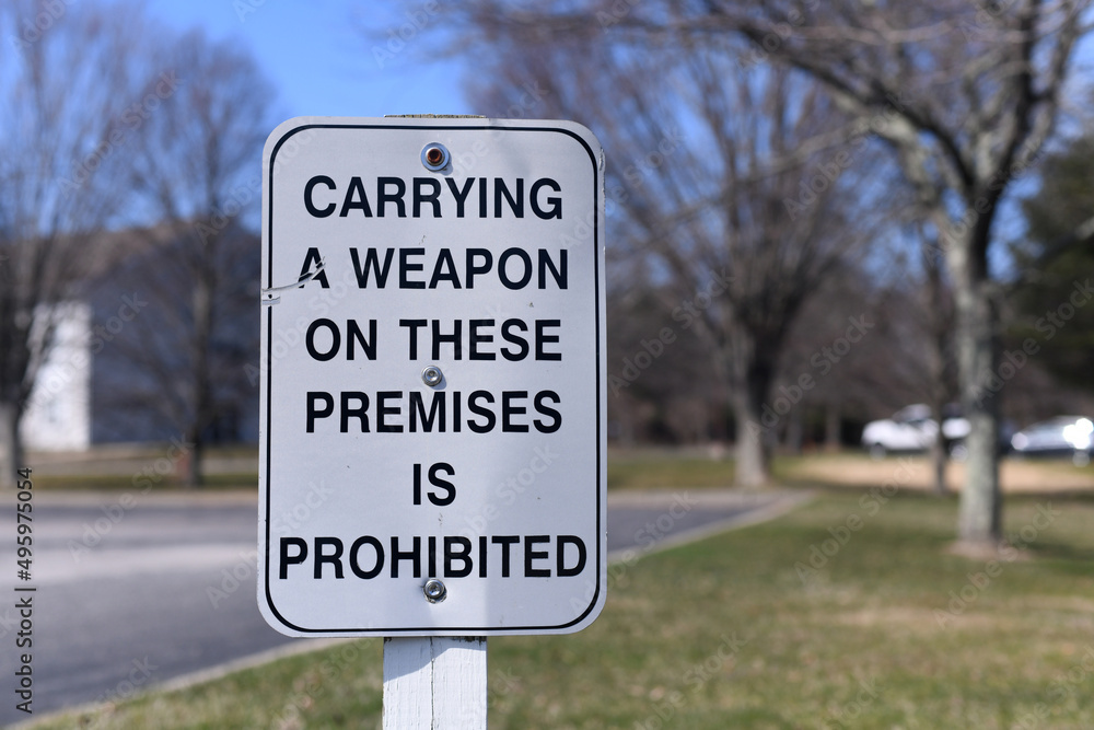 Carrying a Weapon on these premises is prohibited sign 