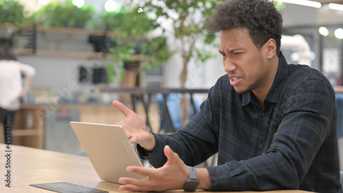 African American Man with Laptop Feeling Angry