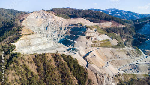 Aerial view of a huge opencast mining area at a mountain in Austria photo