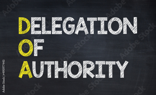 Delegation of authority - DOA acronym written on chalkboard, business acronyms.
