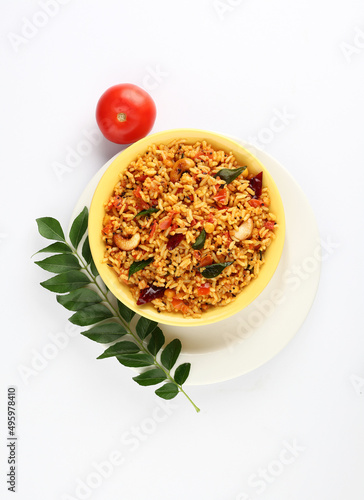 Tomato rice.spicy South Indian rice recipe Tomato pulao or Tomato Rice ,South Indian Thakkali Sadam ,Tomato Bath an Indian vegetarian dish. Healthy nutritious photo