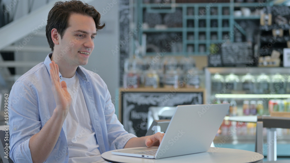 Creative Man Waving for Video Call on Laptop Creative Man Waving for Video Call on Laptop